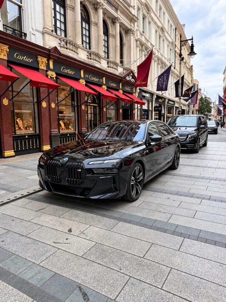 Black Royale Chauffeurs BMW 7 Series parked on Bond Street outside Cartier in London