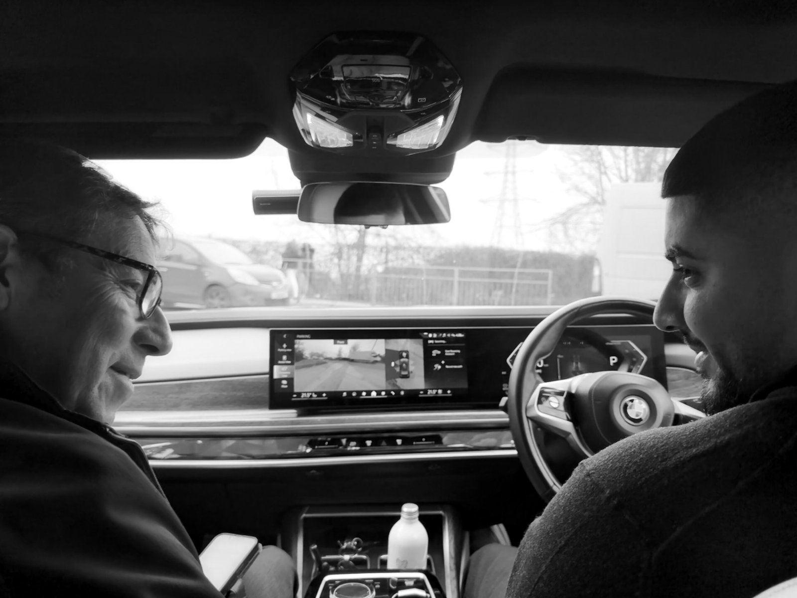 View from the rear seat of a Black Royale chauffeur car towards the driver