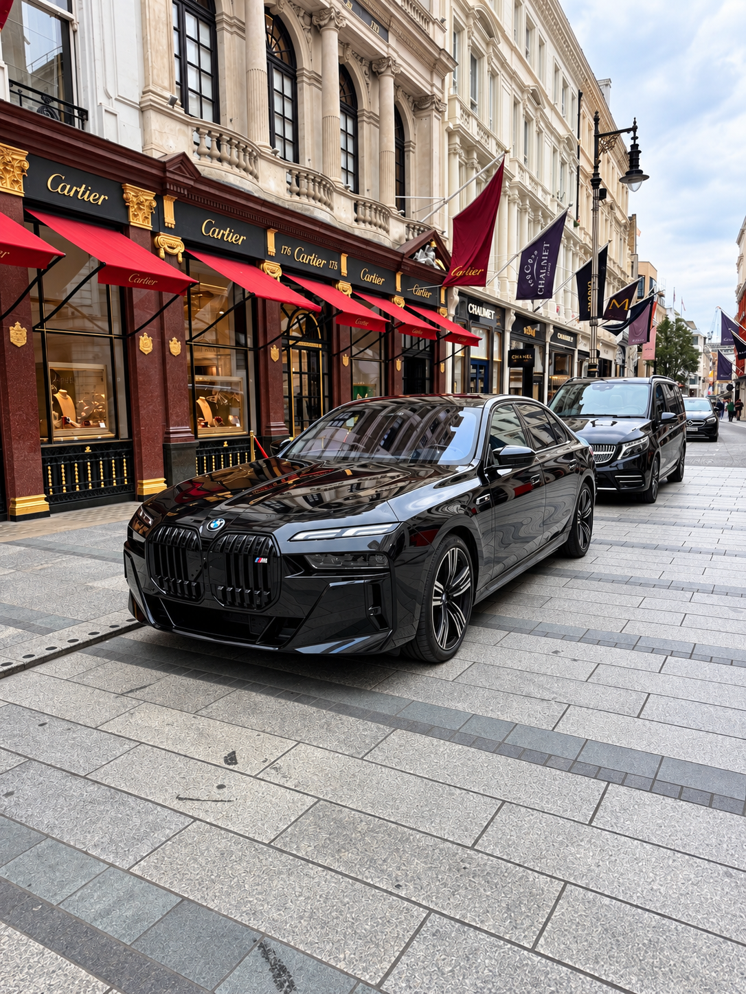 Black Royale chauffeur car on a London street ready for an airport transfer